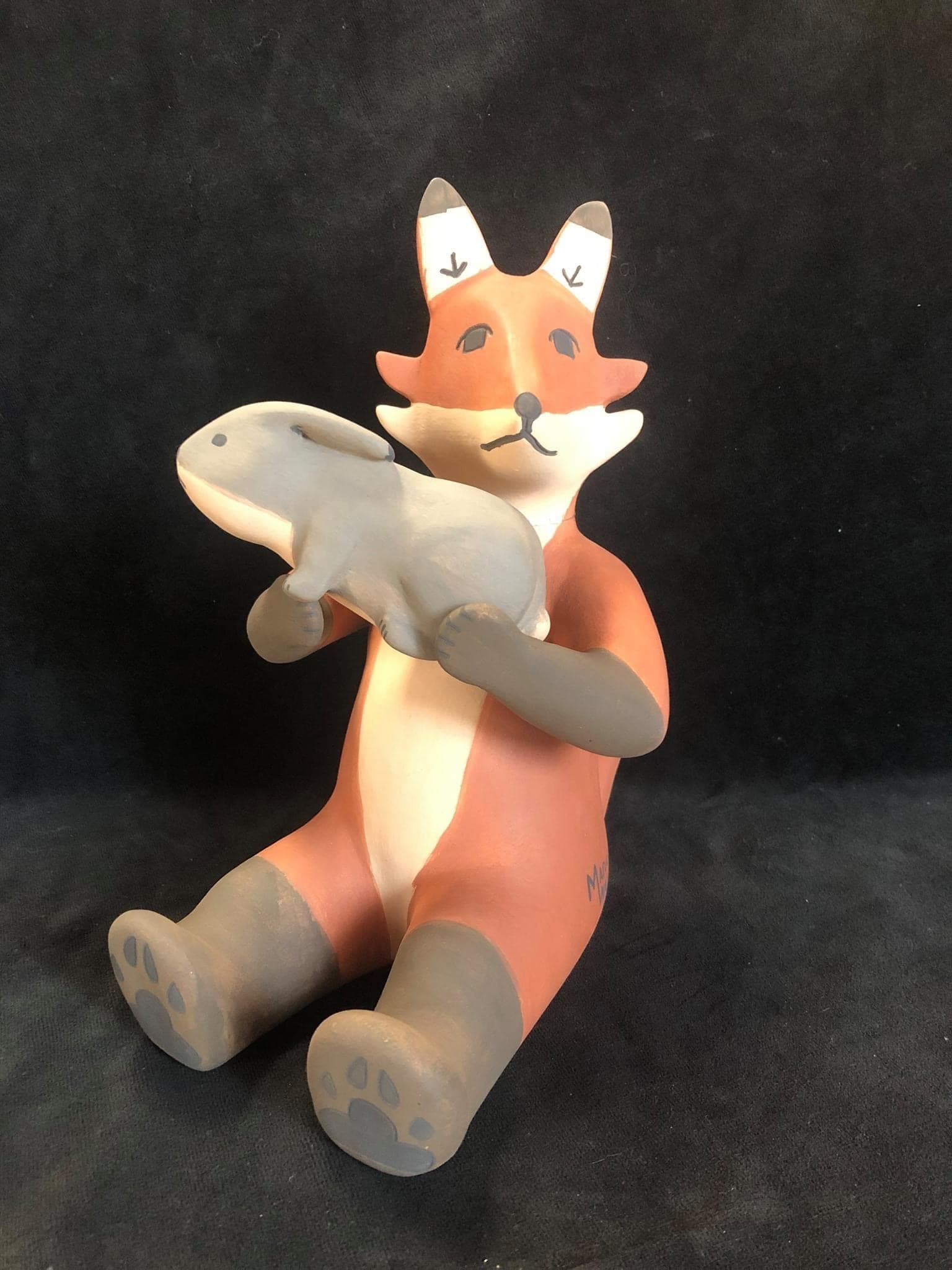 Fox with rabbit