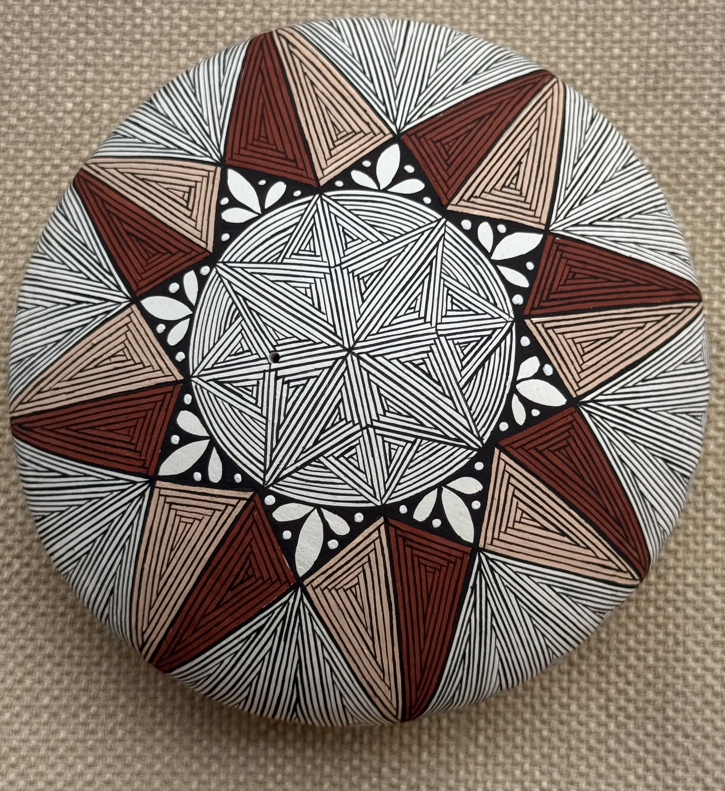 Large red and tan seed-pot with line work